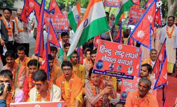 Nepalese people holding a protest at Jantar Mantar in New Delhi on Tuesday against the Nepali government demanding restoration of Nepal as Hindu country (Photo: PTI) Nepalese people holding a protest at Jantar Mantar in New Delhi on Tuesday against the Nepali government demanding restoration of Nepal as Hindu country (Photo: PTI)